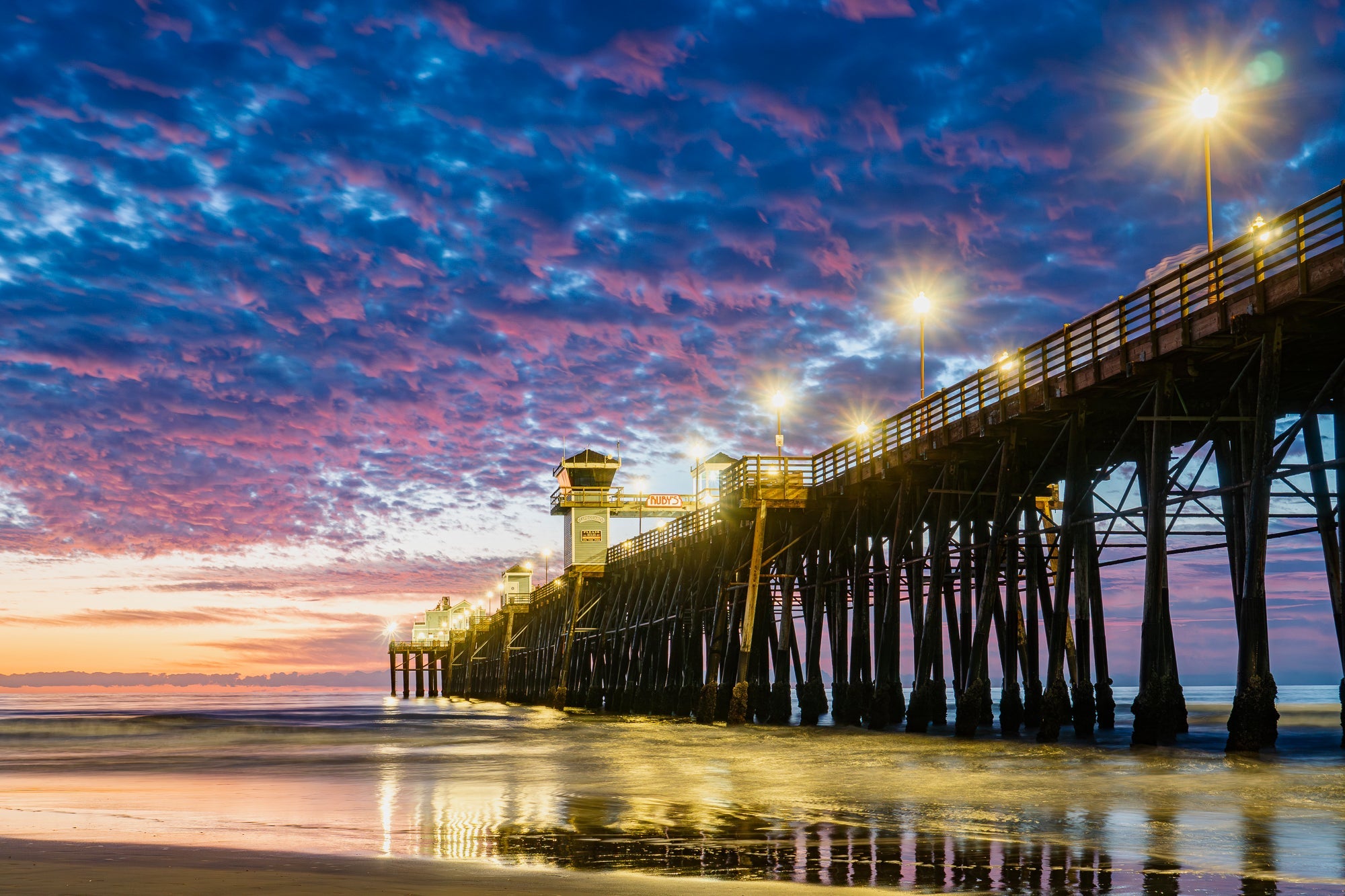 Oceanside city skyline with sunset and ocean views