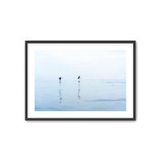 Framed artwork of two birds on a misty lake with a black frame.