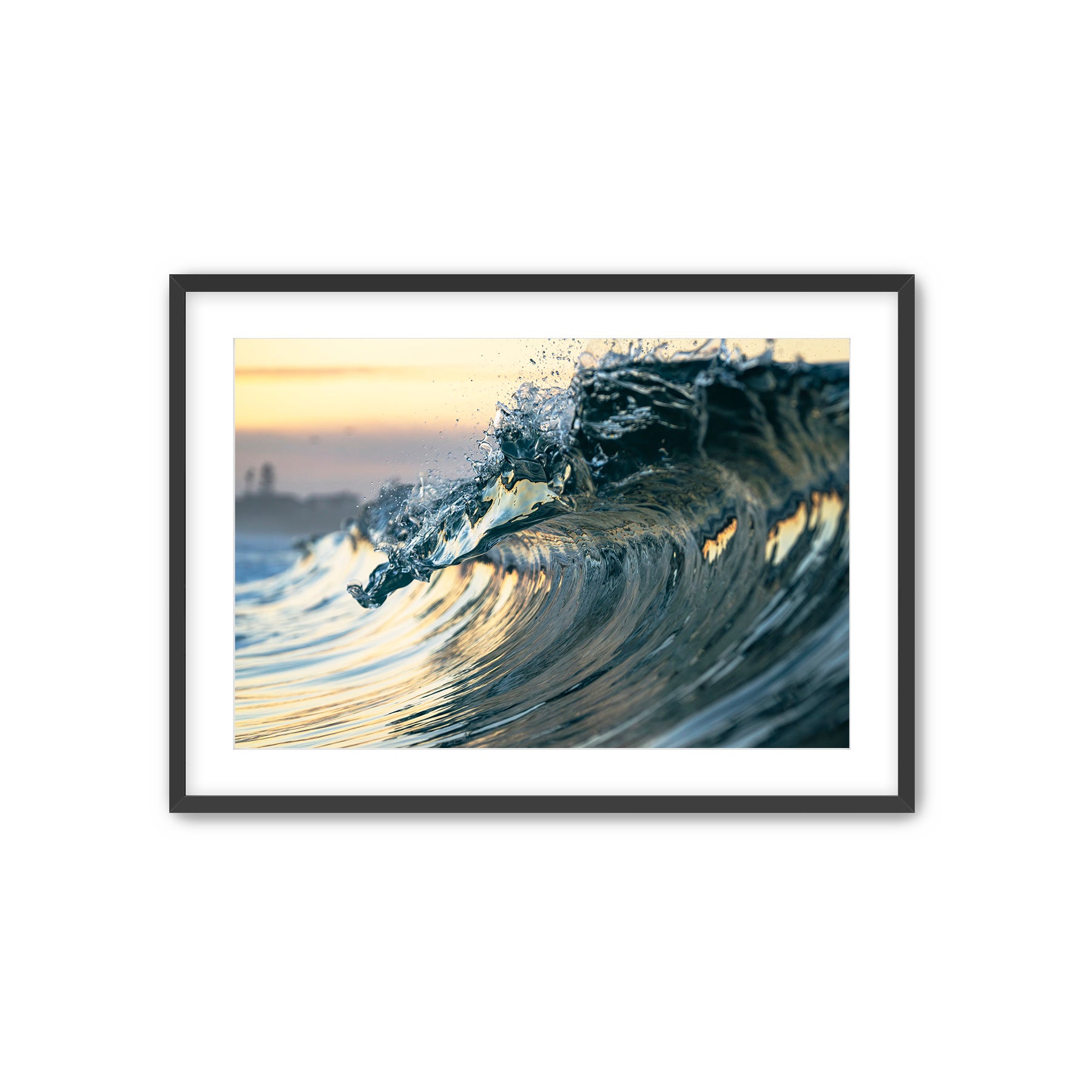 Framed photograph of a wave crashing with a white background.