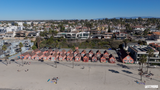 TV/Computer Screensaver: Oceanside Pink Houses and Pier 4K Drone Footage