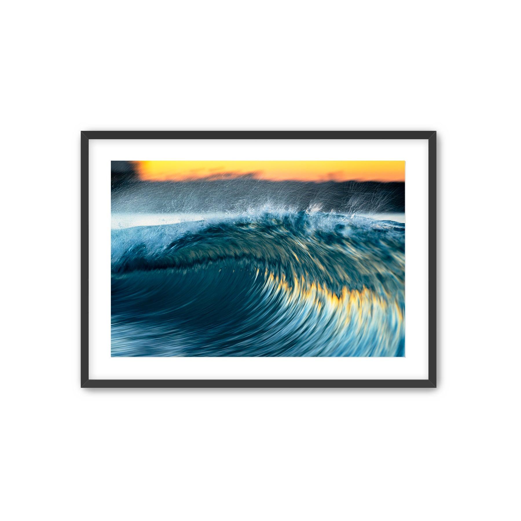 Framed photograph of a wave with a sunrise in the background. Tamarack Beach Carlsbad.