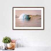 Framed artwork of a warm wave on a wall above a desk with office supplies. South Carlsbad State Beach, Carlsbad, California. 