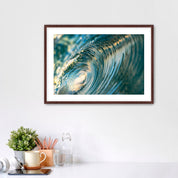 Framed photo of the inside of a barreling wave. 