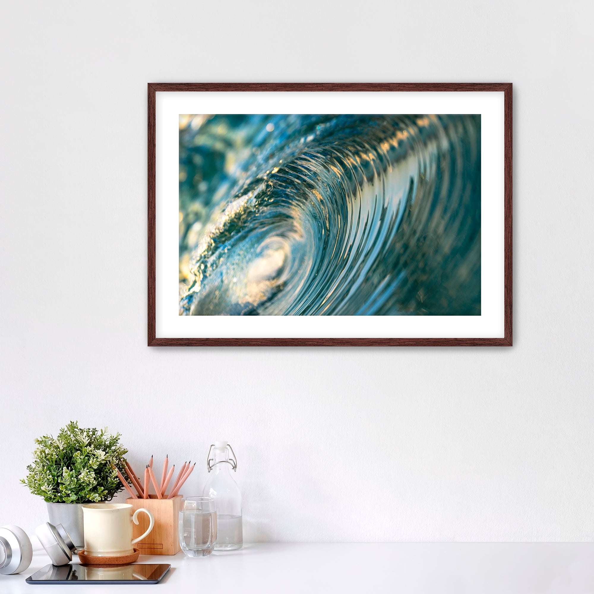 Framed photo of the inside of a barreling wave. 