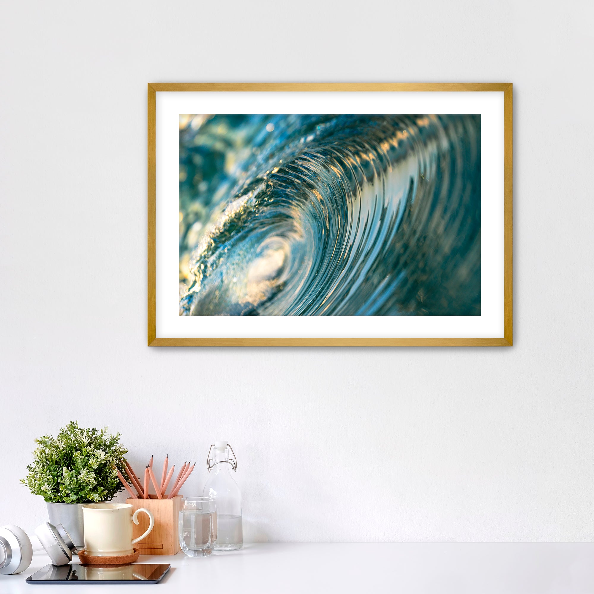 Framed photo of the inside of a barreling wave. 