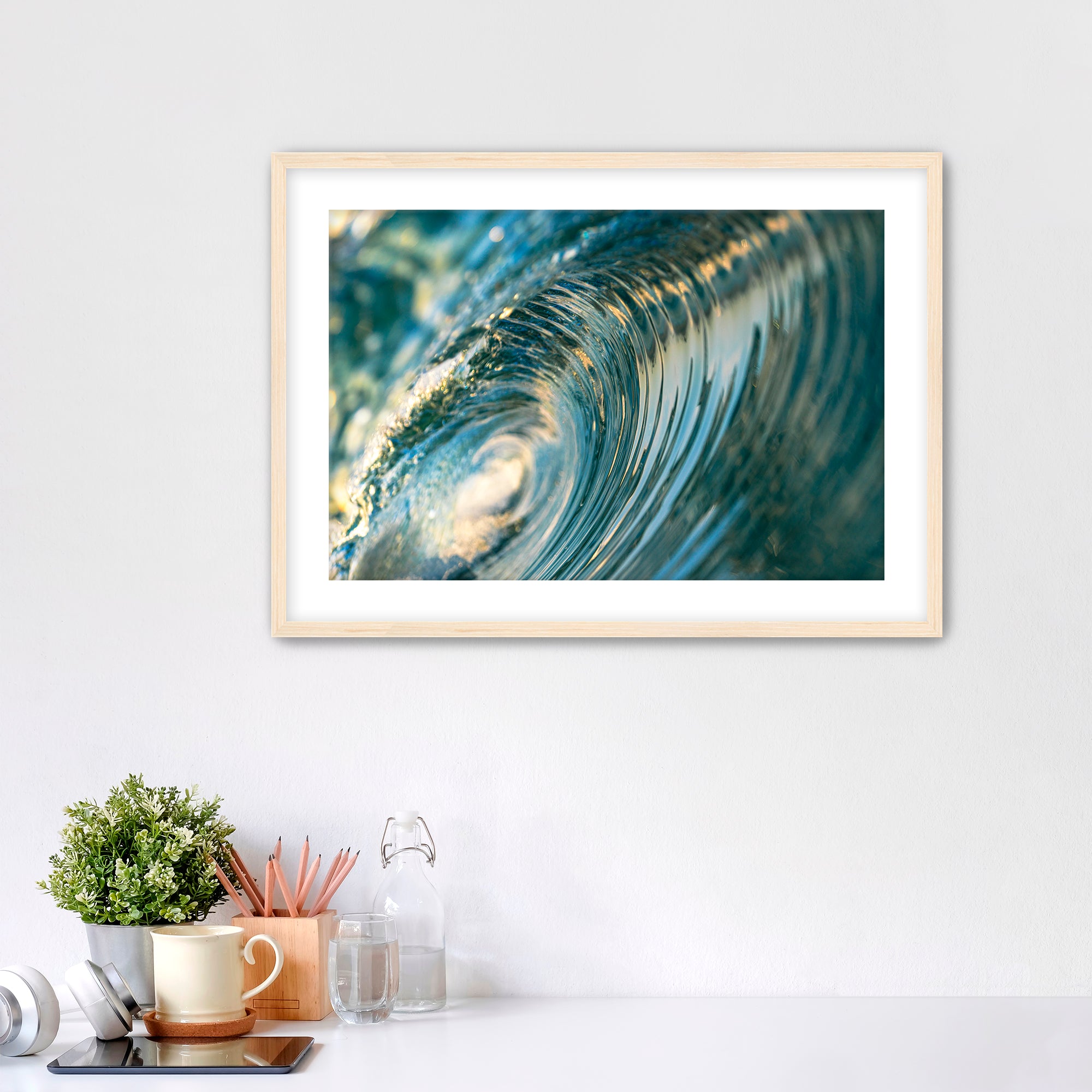 Framed photo of the inside of a barreling wave. 