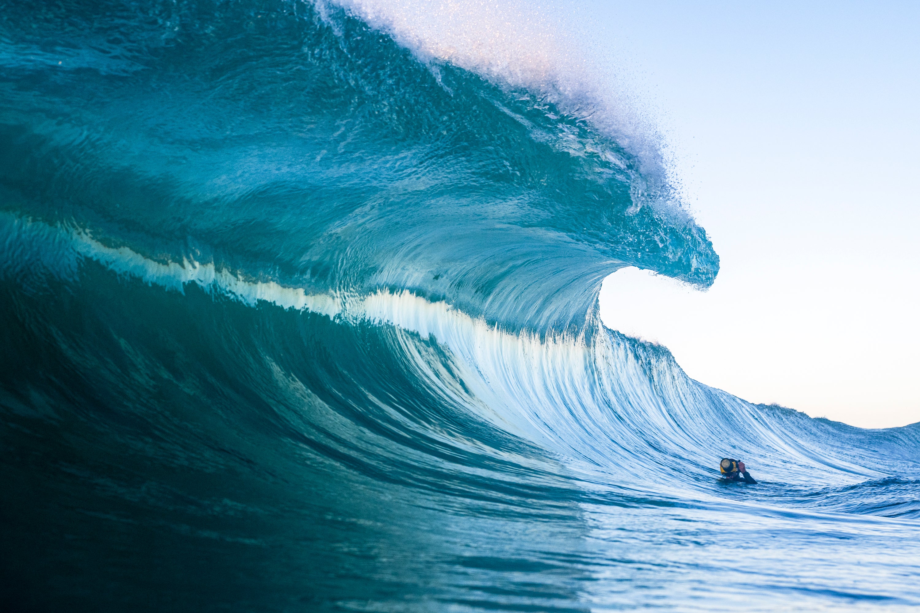 Todd Willer, ocean photographer, taking a photo of a large wave at The Wedge, Newport Beach, California. 