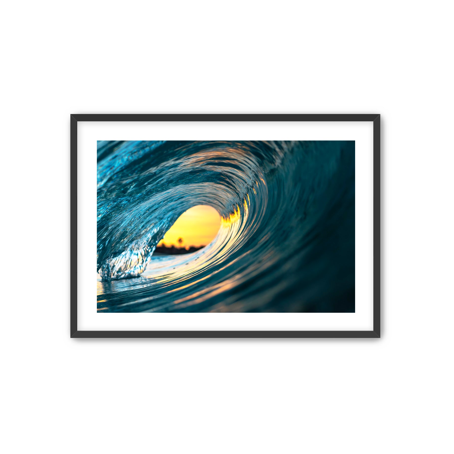 Framed photograph of a swirling wave with a bright center on a white background.